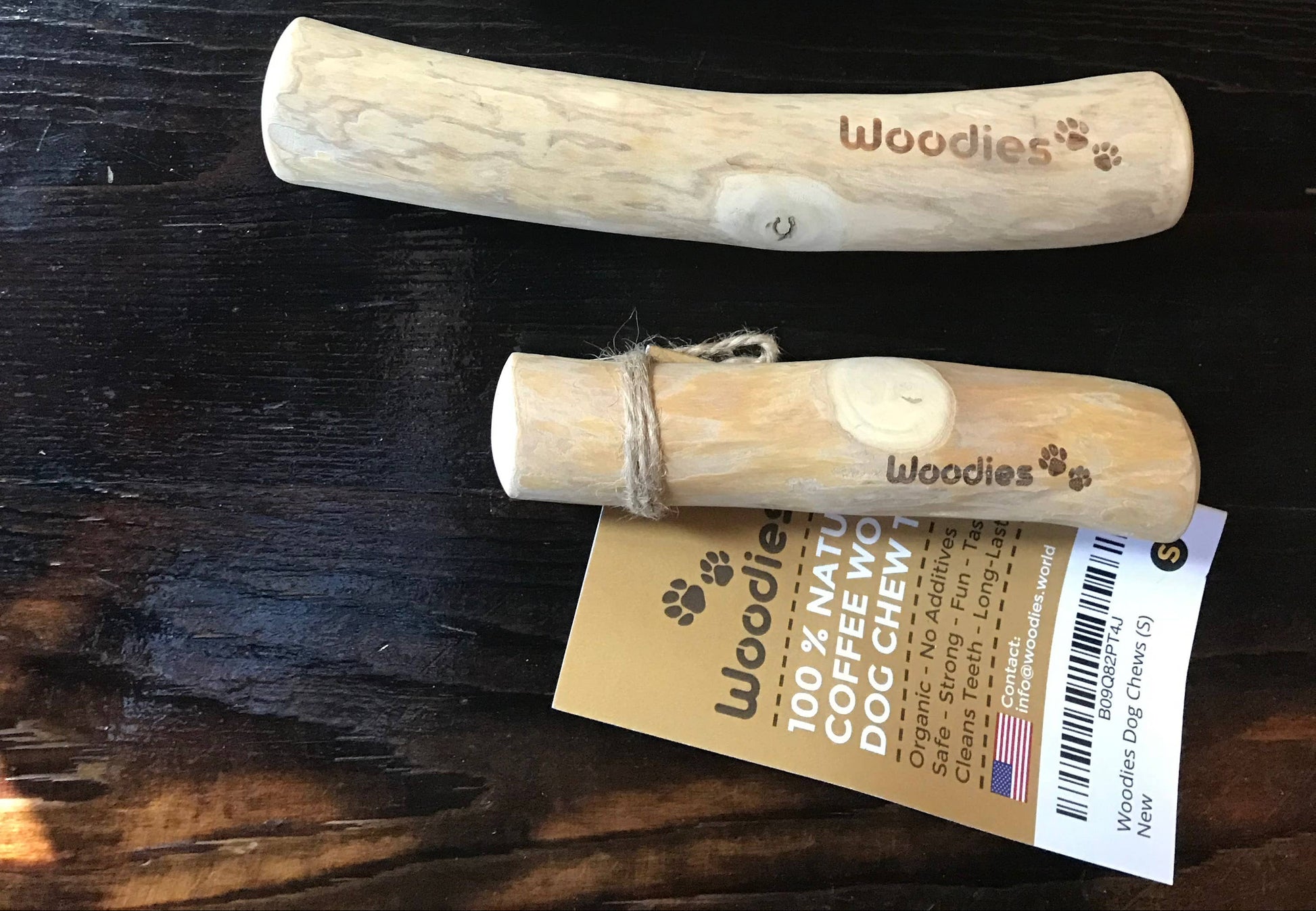 Two wooden dog chews with Woodies stamped on the side. 